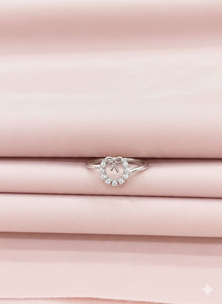 92.5 Silver Round With Bow ring